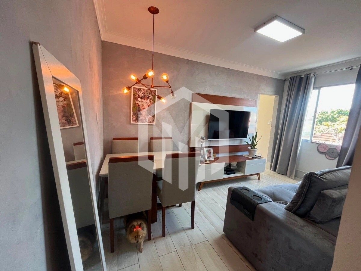 Apartamento reformado a 100m da praia no Boqueirão com vaga e documentação regular